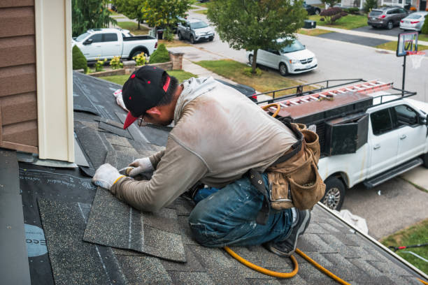 Professional Roofing technician working in North Greece, NY